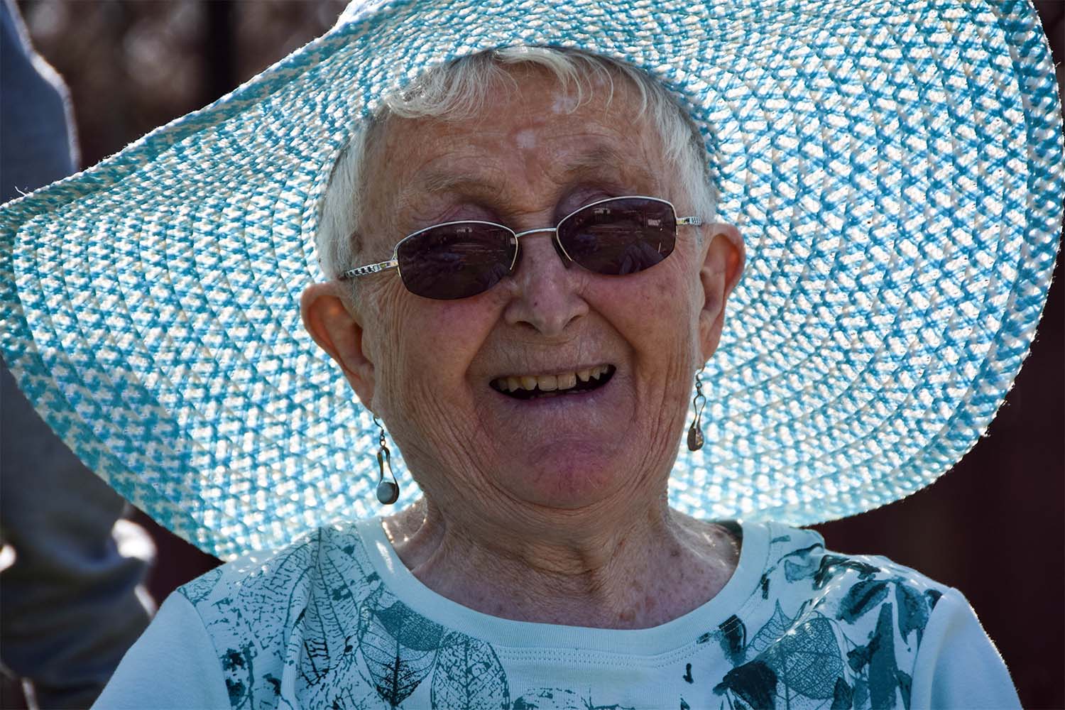 resident-smiling-with-sun-hat-on