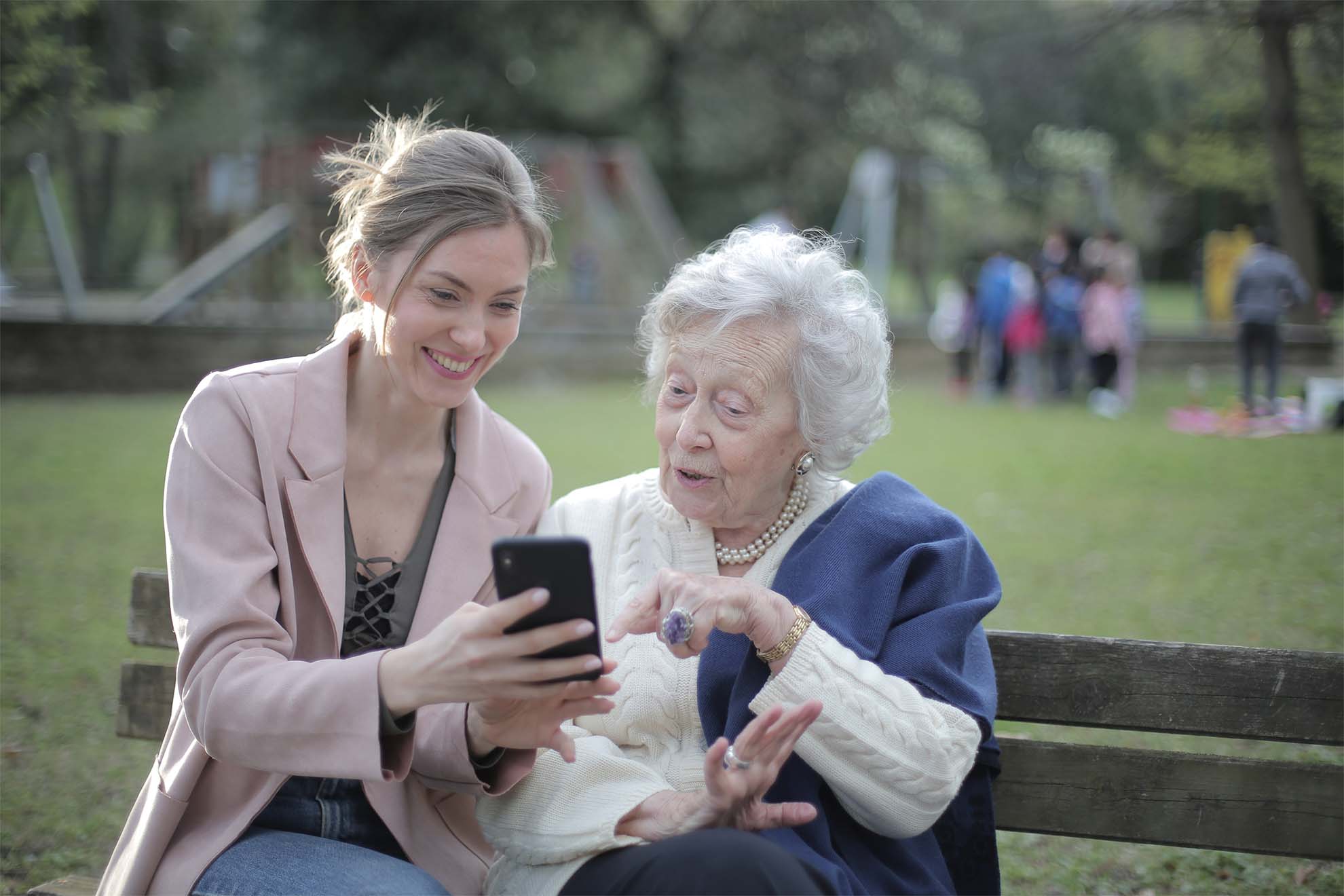 resident-and-family-member-socalising-on-a-bench