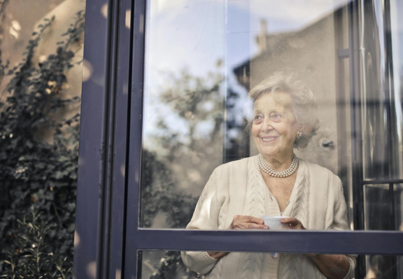 resident smiling and looking out the window
