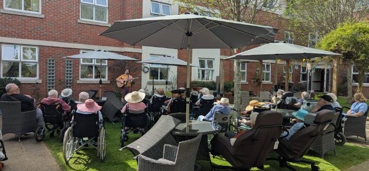 residents outside enjoying the music and food