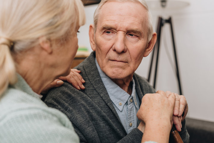 man and family member looking at each other