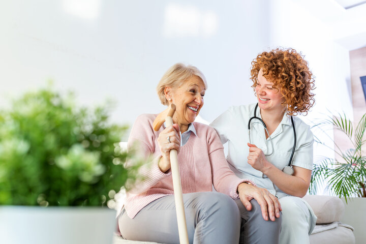 caregiver with resident on a sofa in a care home