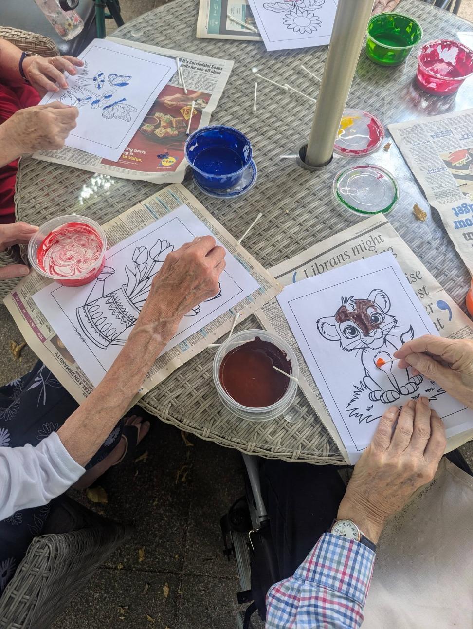 residents hands painting